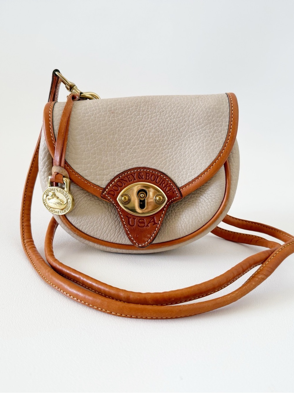 Dooney & Bourke Crossbody Belt Bag Cream Pebbled Leather with Brown Trim Mini